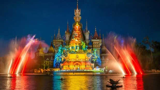 Illuminated castle with colorful lights and fountains at night, VinWonders Phu Quoc, Vietnam Honeymoon Trip